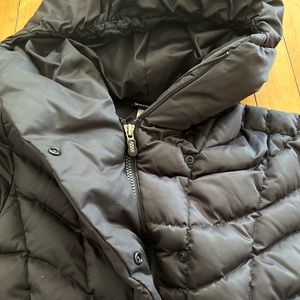 Women’s Patagonia black size M heavy weight down jacket.  Hits mid hips.